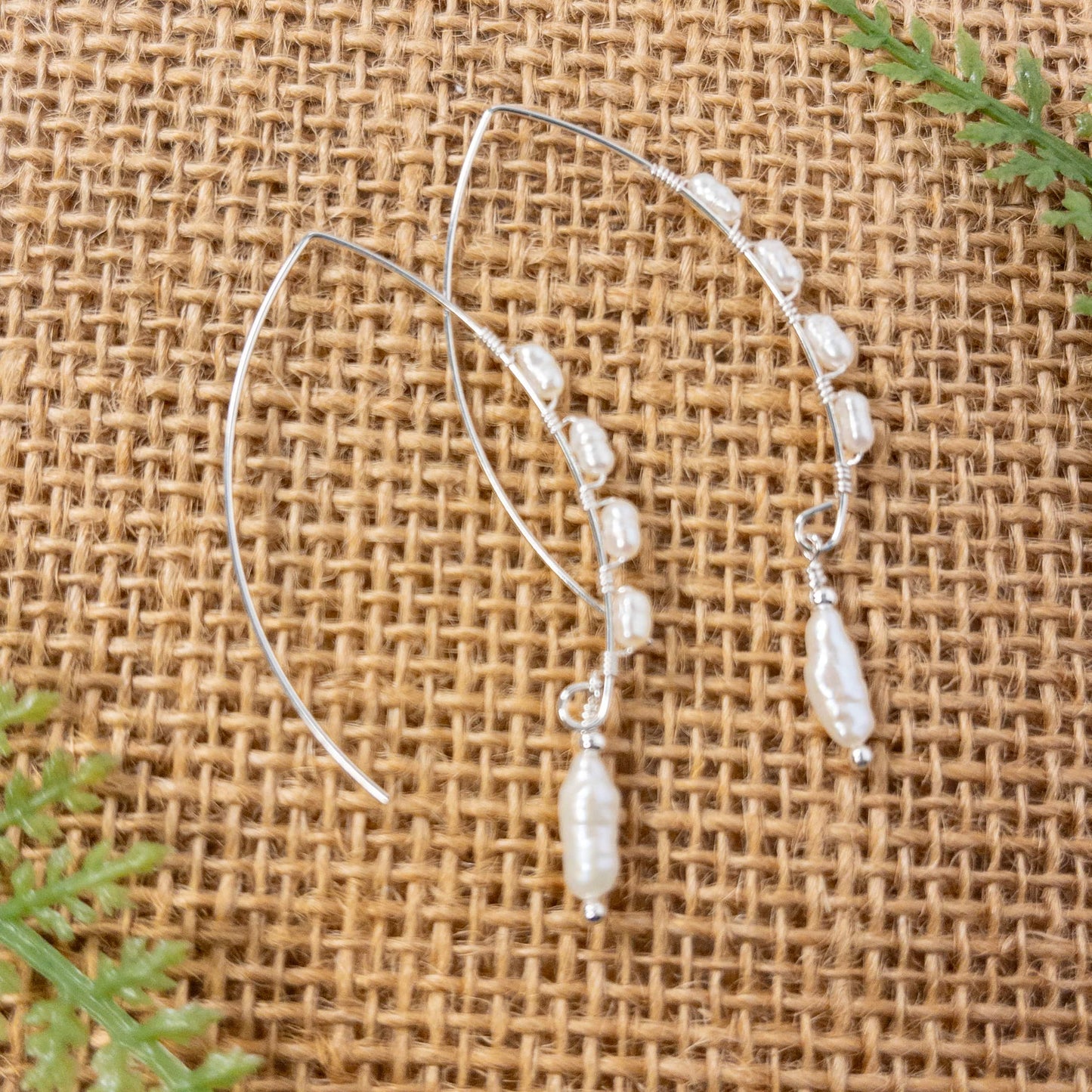 Marquis shaped ear wires are wire wrapped with vintage rice pearls and include a single pearl dangle