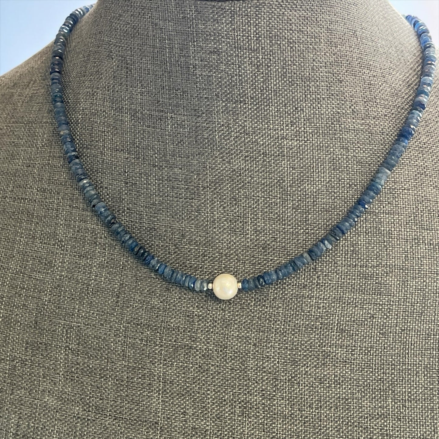 Blakeley Lane Jewelry beaded necklace featuring faceted blue sapphire rondelles and a central freshwater pearl accent.