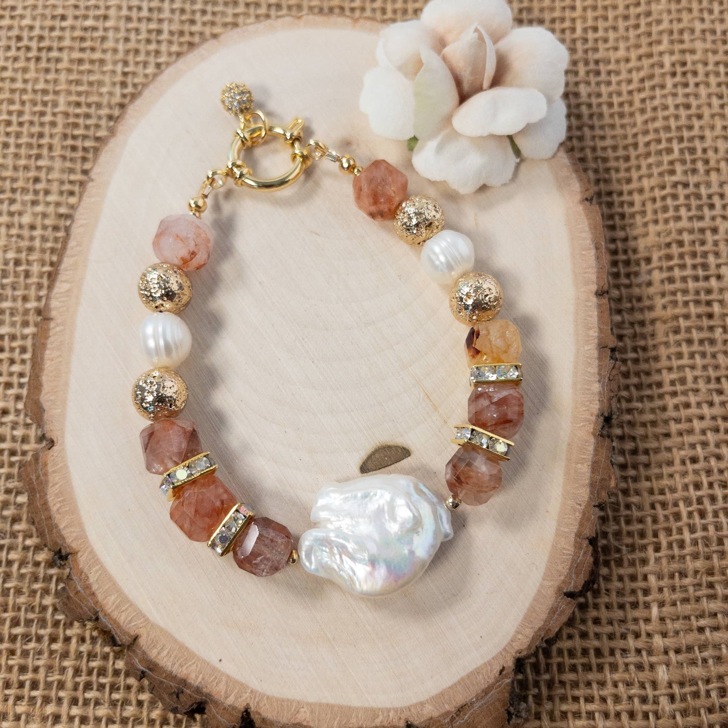 This bracelet features a stunning baroque pearl focal surround by cube shaped hematoid quartz beads that are separated by square pave crystal spacers.  Truly a one-of-a-kind bracelet