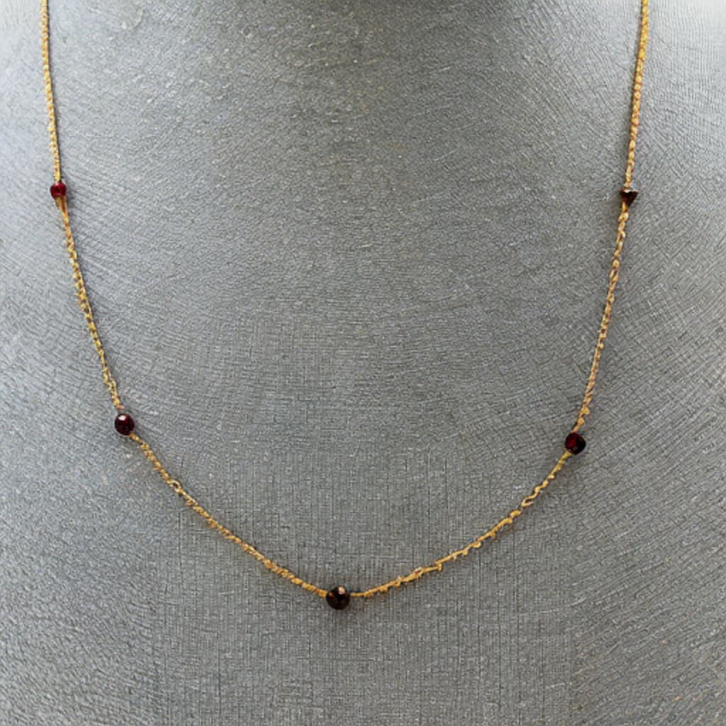 Fine gold cable chain, adorned with faceted 3mm round garnet beads