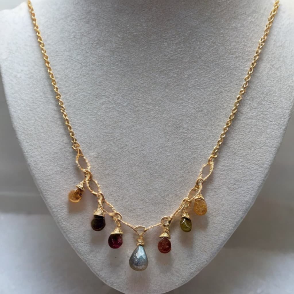 This is a 16 inch gold chain necklace which includes a 2 inch extender.  Tear drop shaped tourmaline and labradorite gemstones dangle from the chain.   