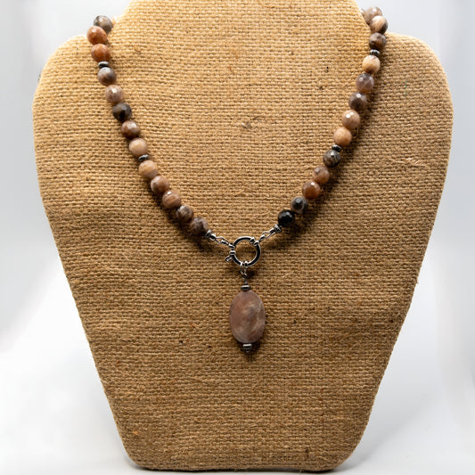 This pendant necklace is made with faceted black and peach moonstones.  It includes a removable faceted oval peach moonstone.  