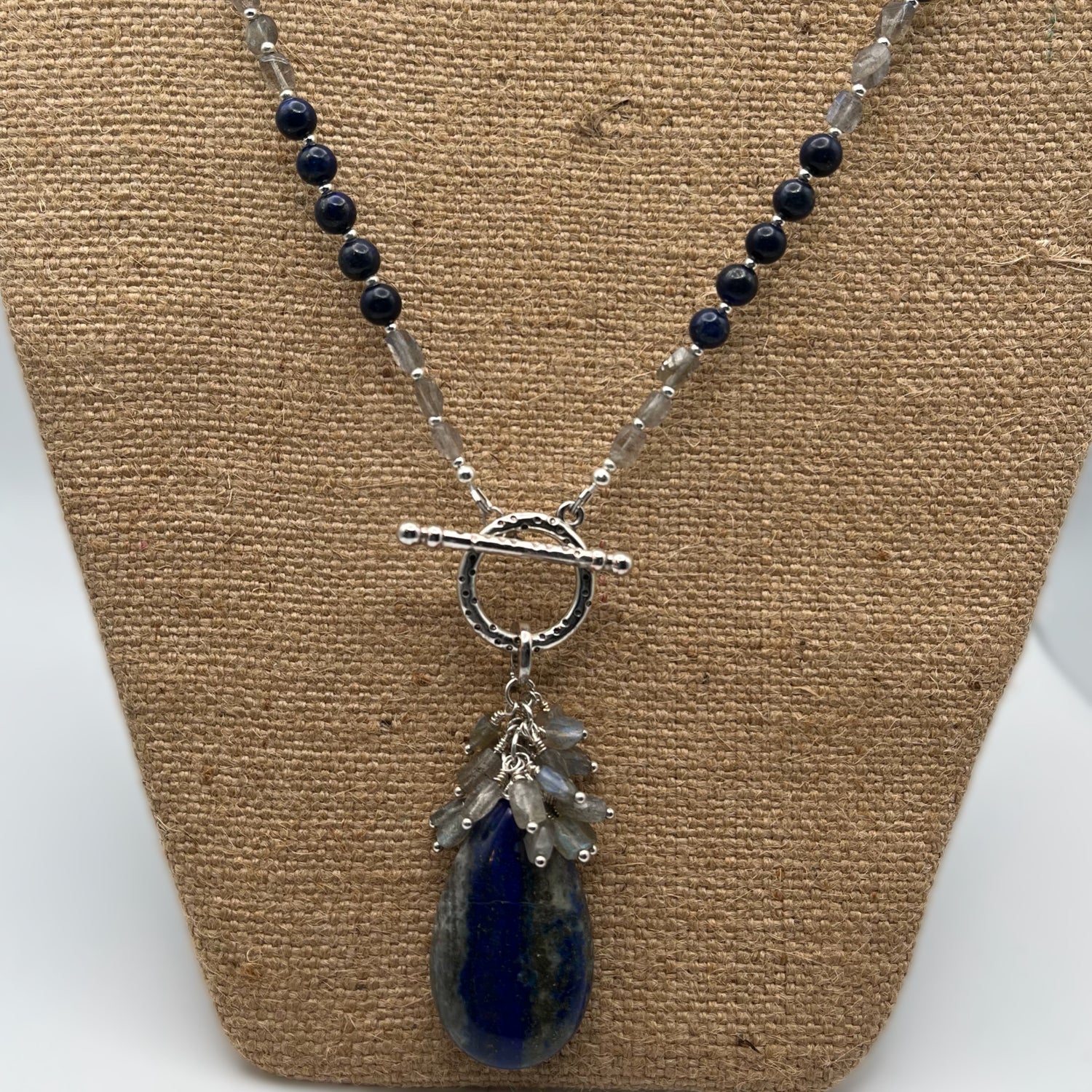 18 inch necklace made with lapis and labradorite beads.  The removeable focal is  a large lapis pear shaped bead accented with labradorite beaded dangles.   
