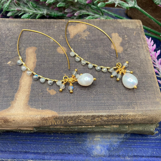 Marquis shaped ear wires are wire wrapped with 3mm Labradorite faceted beads and accented with pearl and Labradorite dangles.