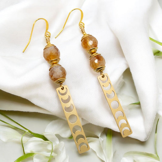 Citrine round beads strung on Gold French wires and accented with a moon phase charm 