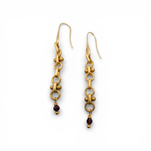 Brass chain earrings with garnet beads on a white background