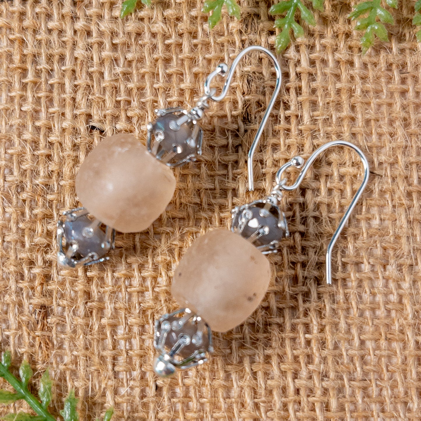 These earrings are made with rose colored recycled glass beads and are accented with soothing grey faceted agate beads.  Silver tone bead caps provide a nice accent to the stones.