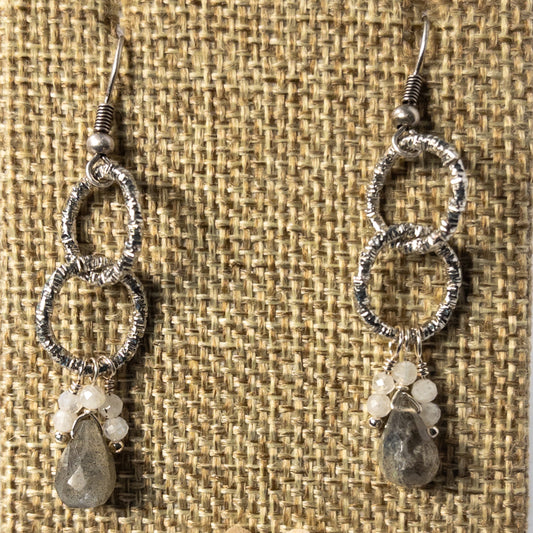 These 1.5 inch drop earrings feature the mesmerizing properties of labradorite and the ethereal beauty of moonstone beaded dangles.   Labradorite briolette beads and moonstone dangle beads are suspended from chain to create a stunning pair of earrings