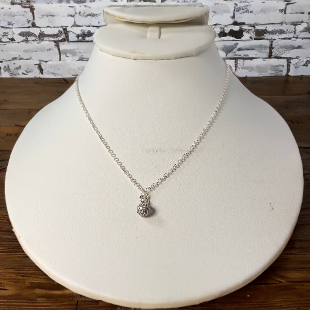 Made with sterling silver cable chain this 16 inch necklace, with 2 inch extender, includes a single pave crystal charm for a touch of elegance. Wear it alone or easily layer it with your other favorite necklaces for a timeless and on-point look