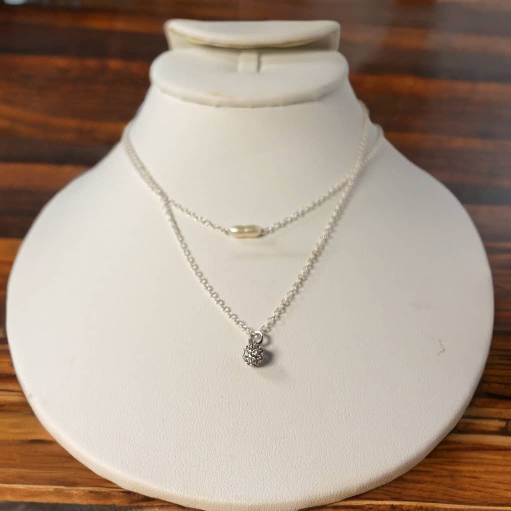  Made with sterling silver cable chain this 16 inch necklace, with 2 inch extender, includes a single freshwater stick pearl for a touch of elegance. Wear it alone or easily layer it with your other favorite necklaces for a timeless and on-point look.