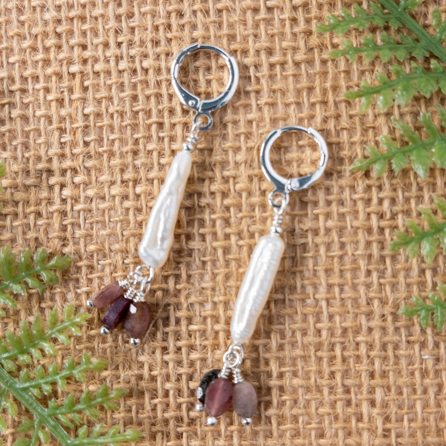 Freshwater stick pearls are hung from sterling silver huggie earwires and are accented with multicolor tourmaline dangles.
