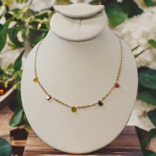 This necklace is made with tear drop shaped tourmaline beads that are individually strung on gold chain.  
