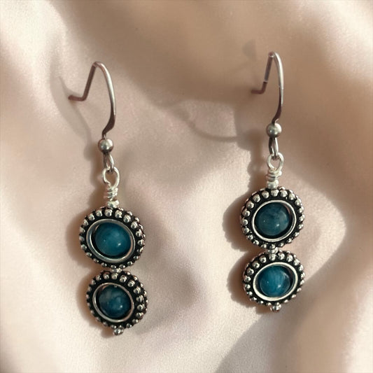 Blakeley Lane Jewelry double-stacked drop earrings with blue cabochon stones and oxidized sterling silver beaded frames.