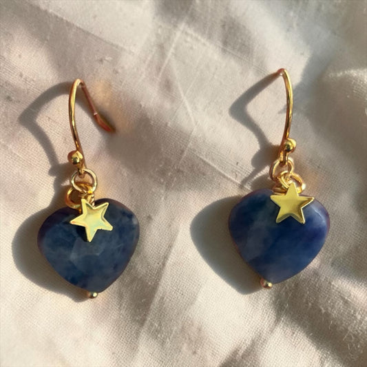 Blakeley Lane Jewelry heart-shaped blue stone drop earrings with gold-tone star charms on fishhook wires.