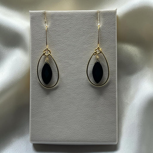 Blakeley Lane Jewelry gold-tone teardrop dangle earrings with marquise-cut black stones and wire-wrapped detail.