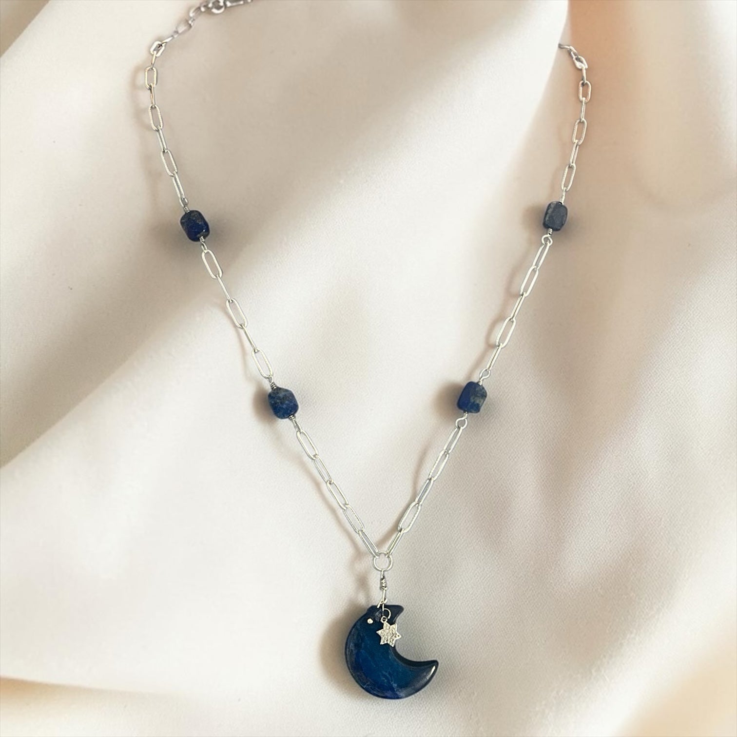 Blakeley Lane Jewelry celestial necklace with a blue lapis lazuli crescent moon pendant and silver star charm.