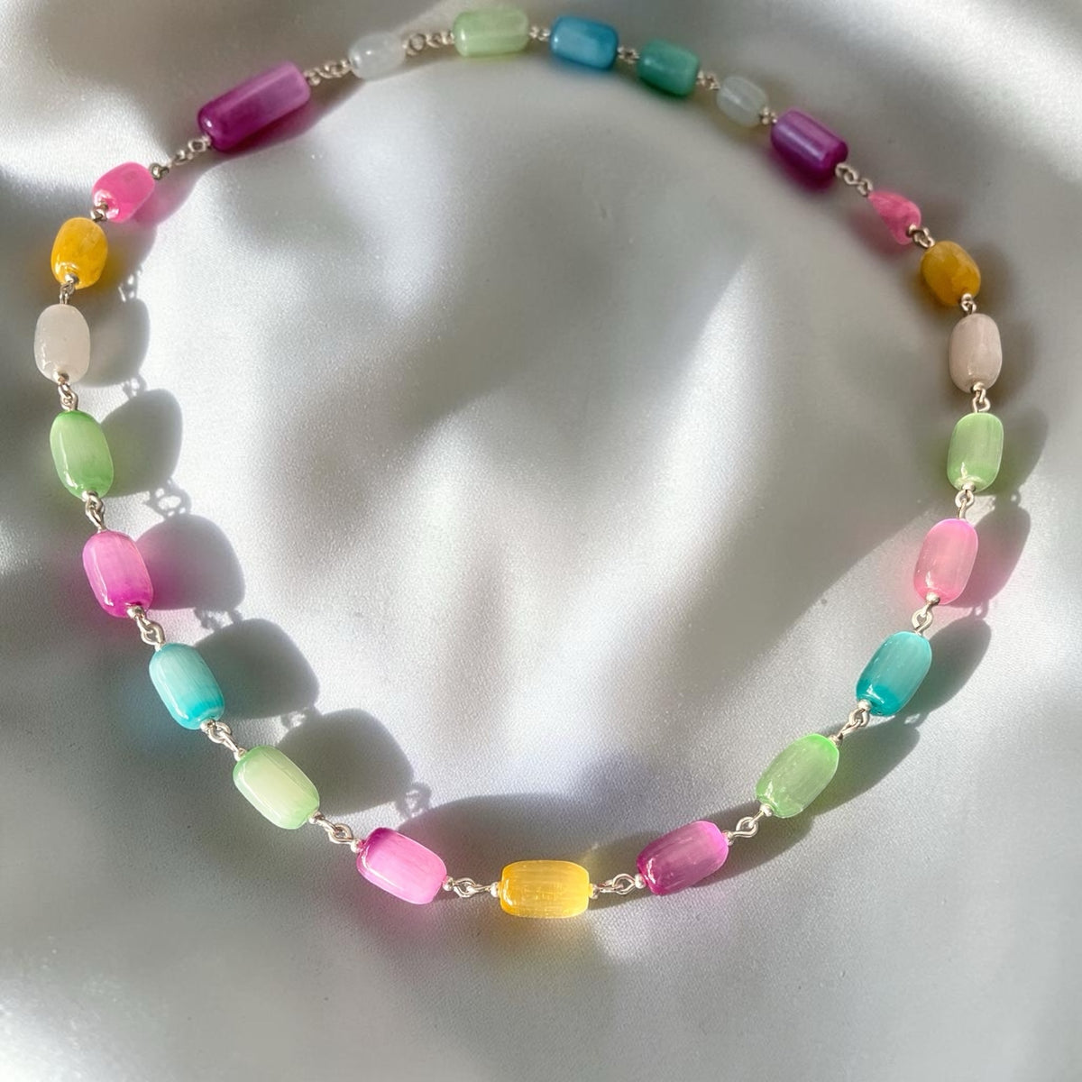 Blakeley Lane Jewelry multicolor beaded statement necklace with cylindrical beads and silver-tone hardware.