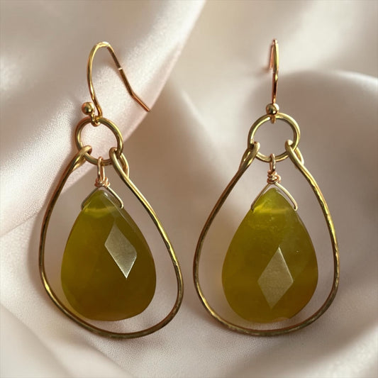 Blakeley Lane Jewelry teardrop earrings with faceted olive-green gemstones in hand-hammered gold-tone frames.
