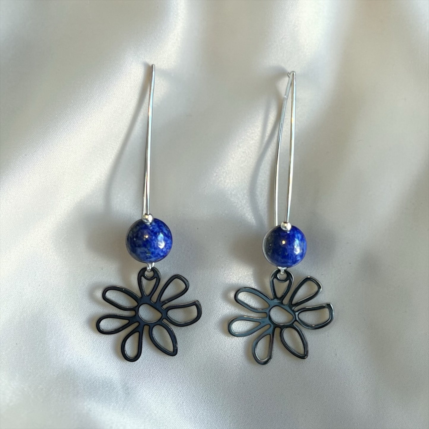 Pair of earrings with Lapis beads and  flower-shaped charms suspended on marquis shaped ear wires