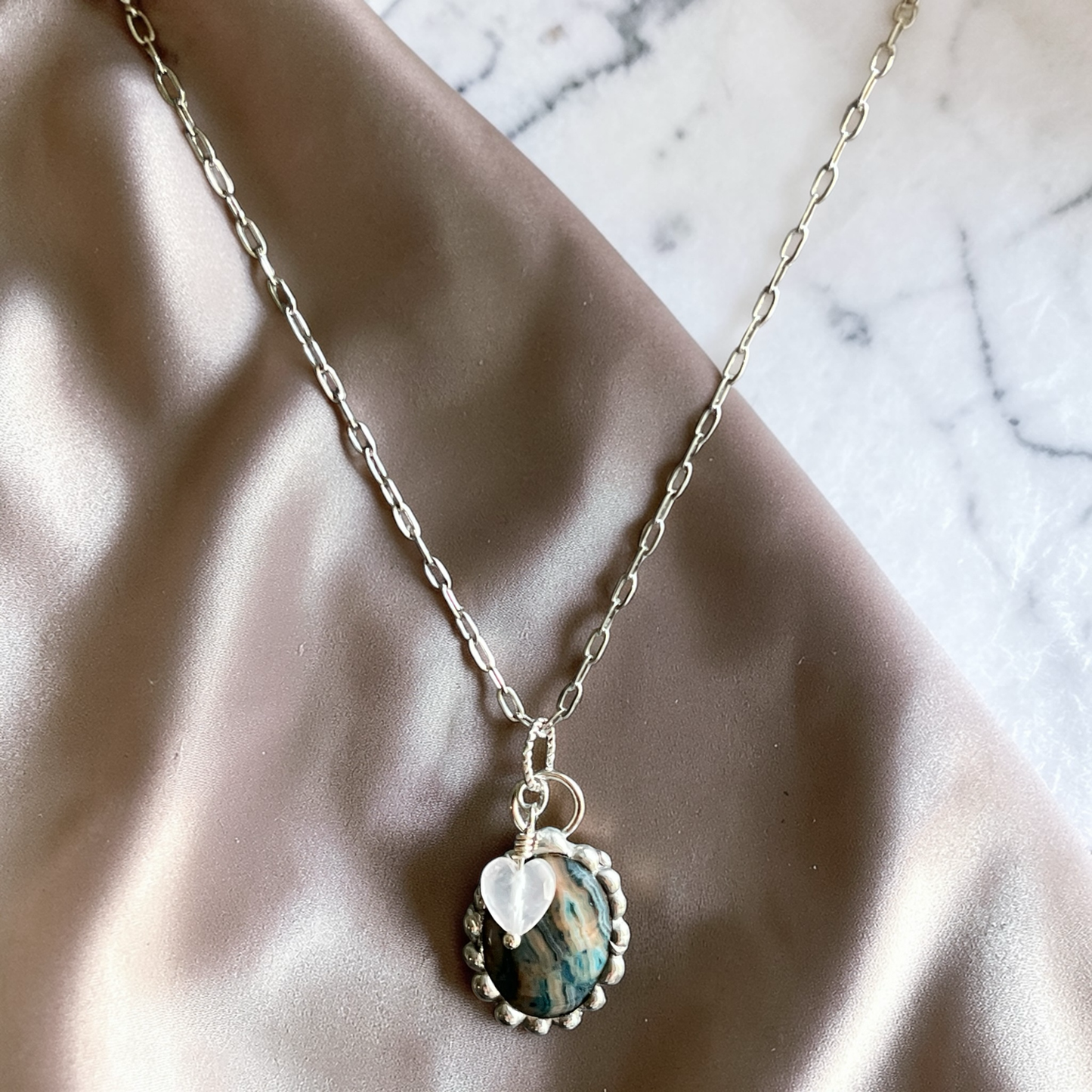 Stainless steel paperclip chain with a soft soldered Larimar Agate pendant and small quartz heart charm