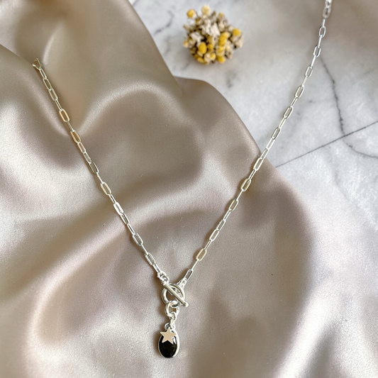 Silver chain necklace with a Labradorite teardrop pendant and start charm.