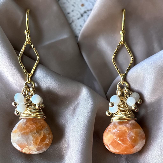 Tear drop shaped calcite stones with small mother of pearl dangles
