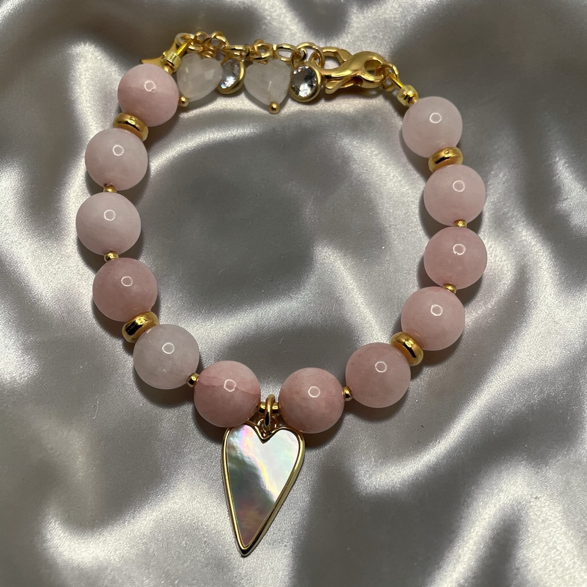 Soft pink gemstone beaded bracelet with heart shaped focal charm
