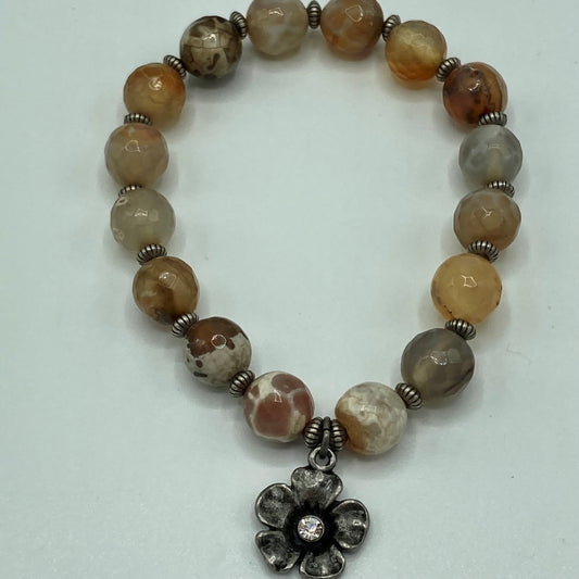 Stretch bracelet made with Agate beads, gunmetal spacer beads, and crystal flower charm.