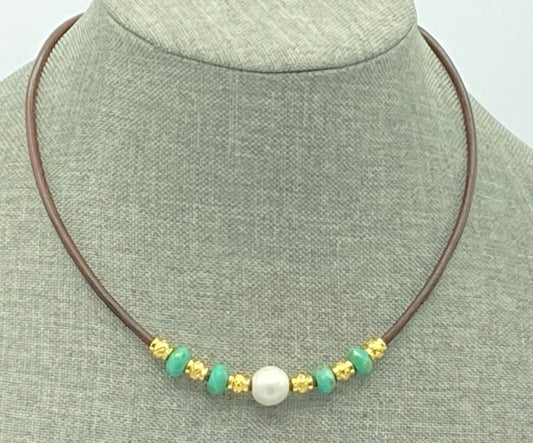 This necklace is made with 3mm brown leather, wooden beads, gold spacer beads, and large hole Czech glass beads. It is 16 inches but will expand to 18 inches.