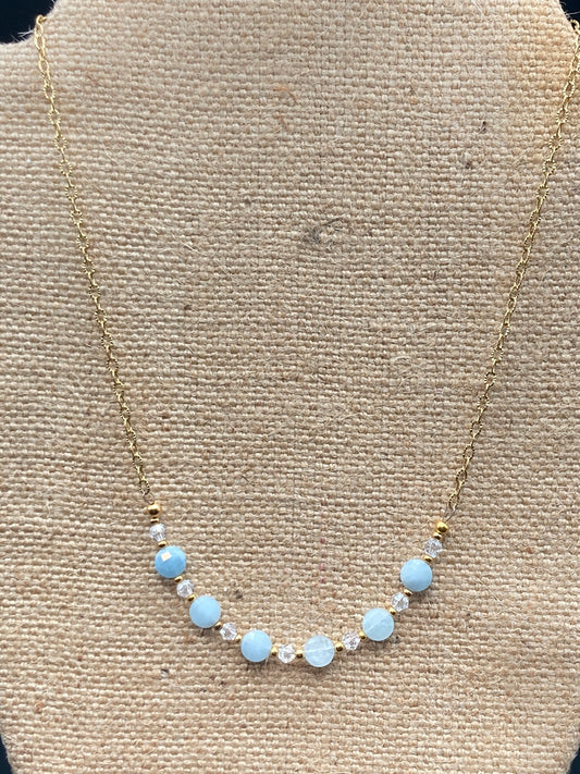 This 16 inch necklace features Aquamarine checkboard coin beads, clear bicones, and small gold spacer beads.  If you love Aquamarine, then this is the necklace for you .