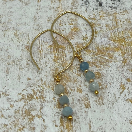 4mm Aquamarine beads and gold spacer bead earrings make for a simple but dainty pair of earrings.