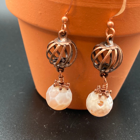 Copper-colored cage beads are accented with Agate bead drops.  These are fun earrings that can be worn with most of your everyday outfits