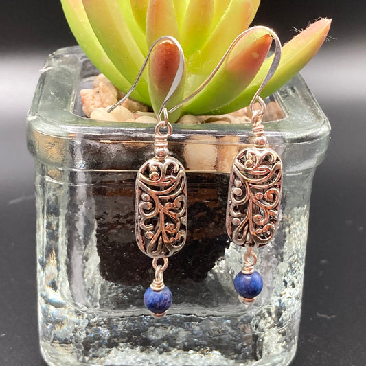 These earrings are made with patterned metal beads which are accented with small Lapis beads.  They can be worn dressed up or down depending upon your mood.