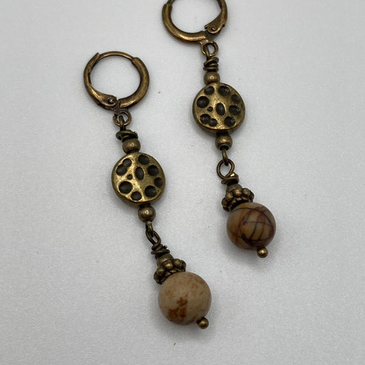 Antique bronze huggie earwires and metal spacer bead elements pair nicely with the 6mm Agate beads.  These earrings measure approximately 1 inch and would pair nicely with an agate stretch bracelet found in the collection.