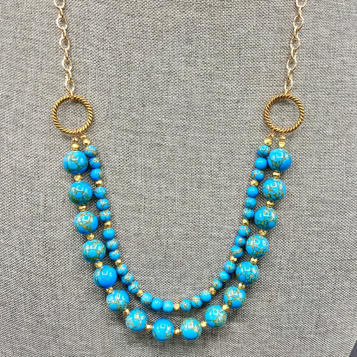 Two-strand necklace is made with 10mm and 4mm Dolomite beads and accented with gold spacer beads. The necklace includes an expander and magnetic clasp.