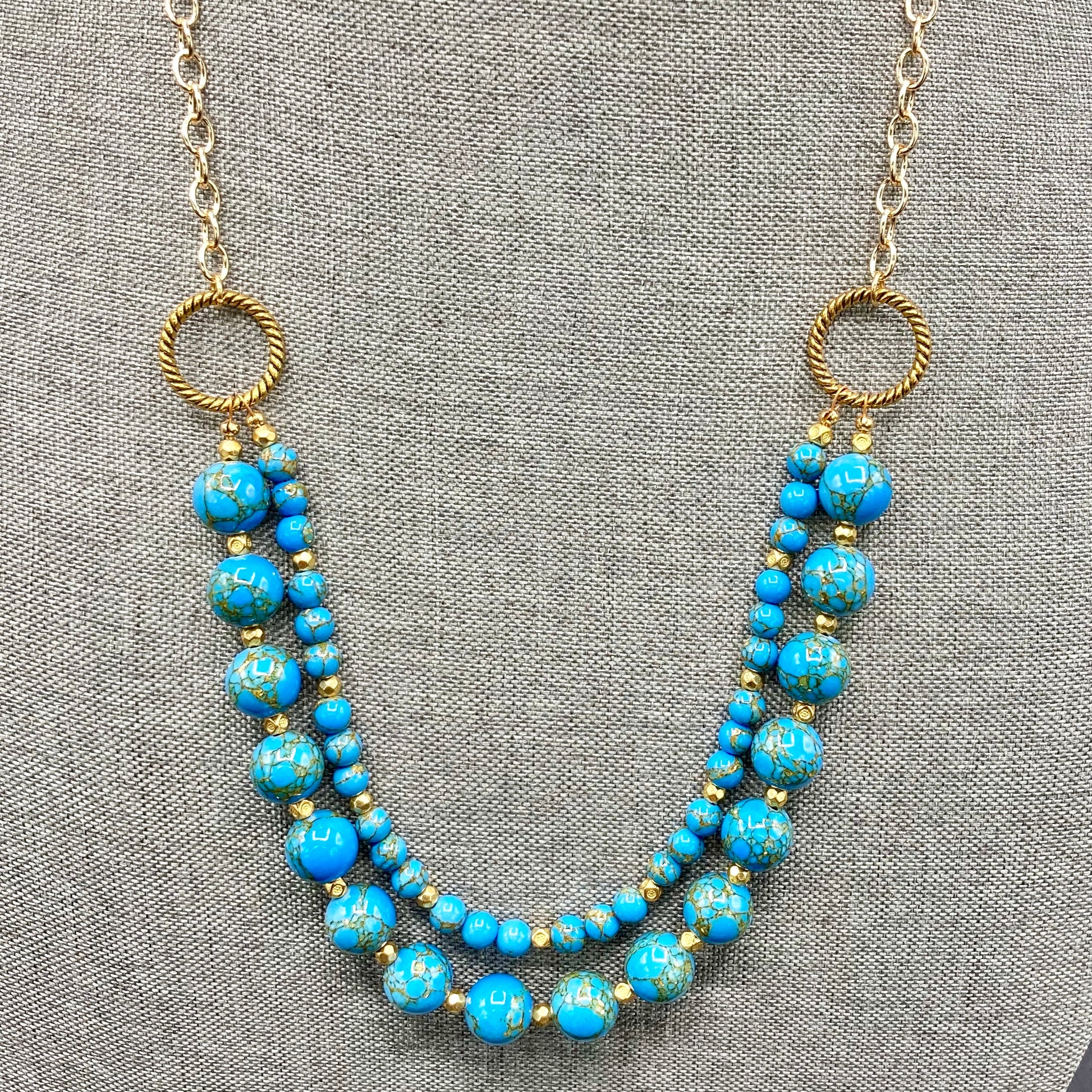 Two-strand necklace is made with 10mm and 4mm Dolomite beads and accented with gold spacer beads. The necklace includes an expander and magnetic clasp.