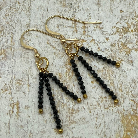 These earrings are made with 2mm Black Spinel and measure approximately 1.25 inches.  The earwires are golld tone