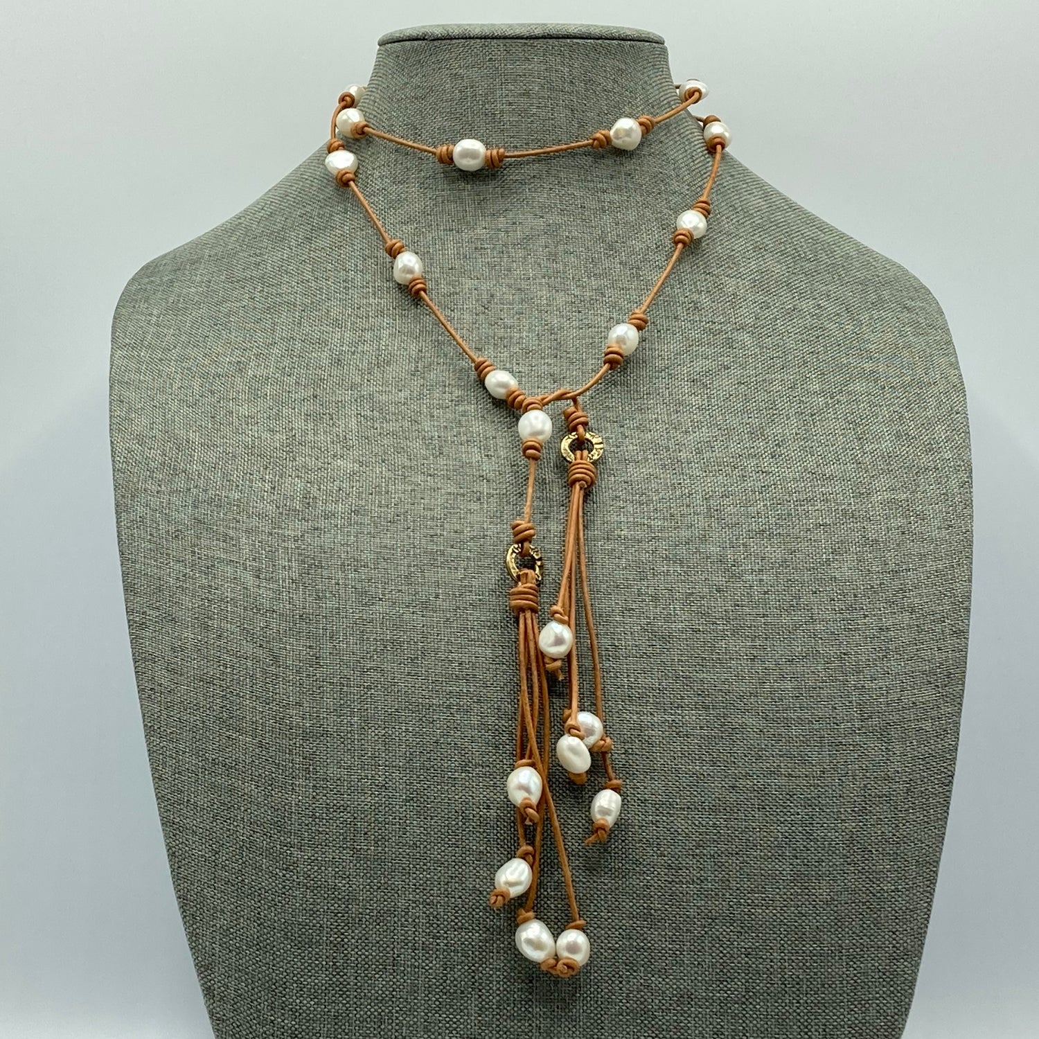 This lariat is made with large hole pearls and 1.5mm leather and can be worn in a variety of lengths.