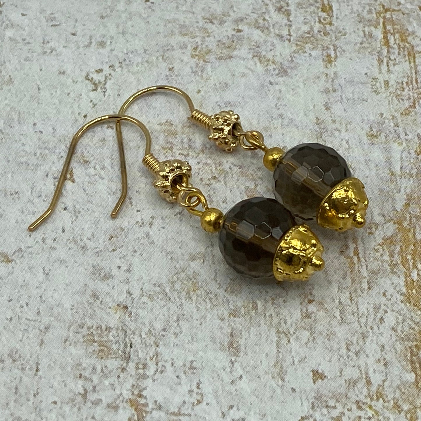 Earrings are made with faceted Smokey Quartz beads and fancy gold headpins.